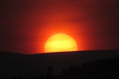 Sun setting over the hill along South Deeside by Maggie McArdle